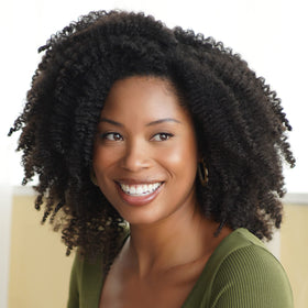 African Pride bottle on bathroom shelf lifestyle image promoting routine use