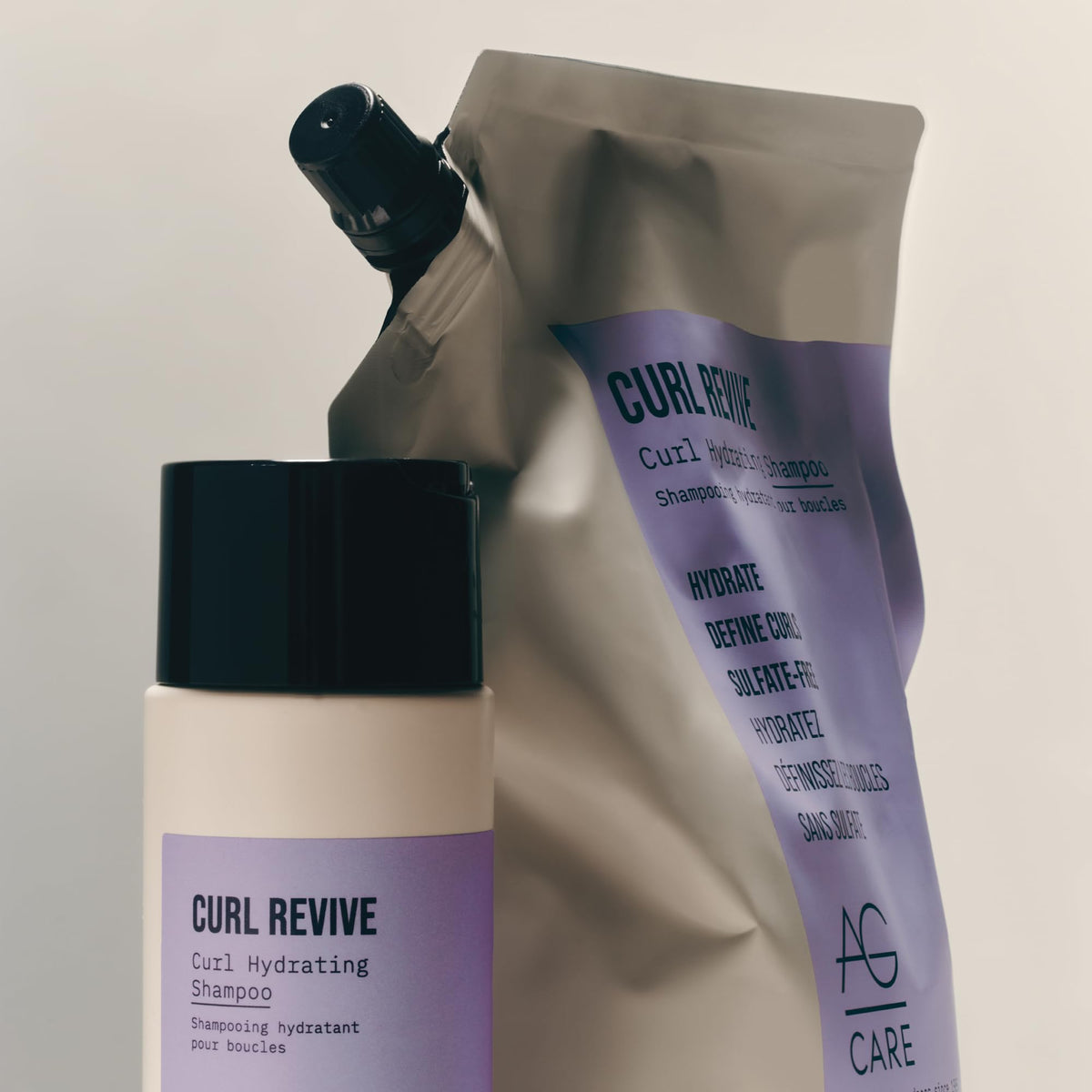 AG Care in-shower lifestyle image with person rinsing defined curls