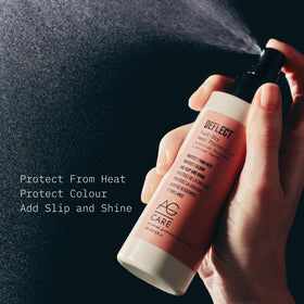 AG Care spray nozzle releasing mist onto hair, even application benefit