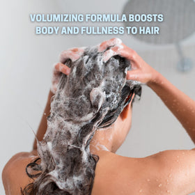Agadir shampoo bottle beside argan berries highlighting nourishing oil