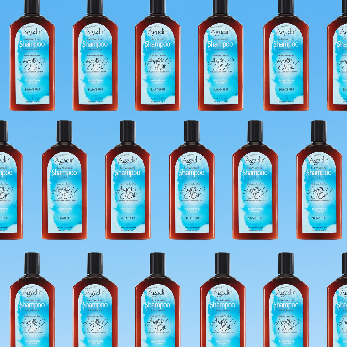 Agadir shampoo bottle held in hand showing 12.4 fl oz scale benefit