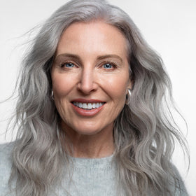 AGE beautiful on bathroom shelf in lifestyle scene suggests daily routine benefit
