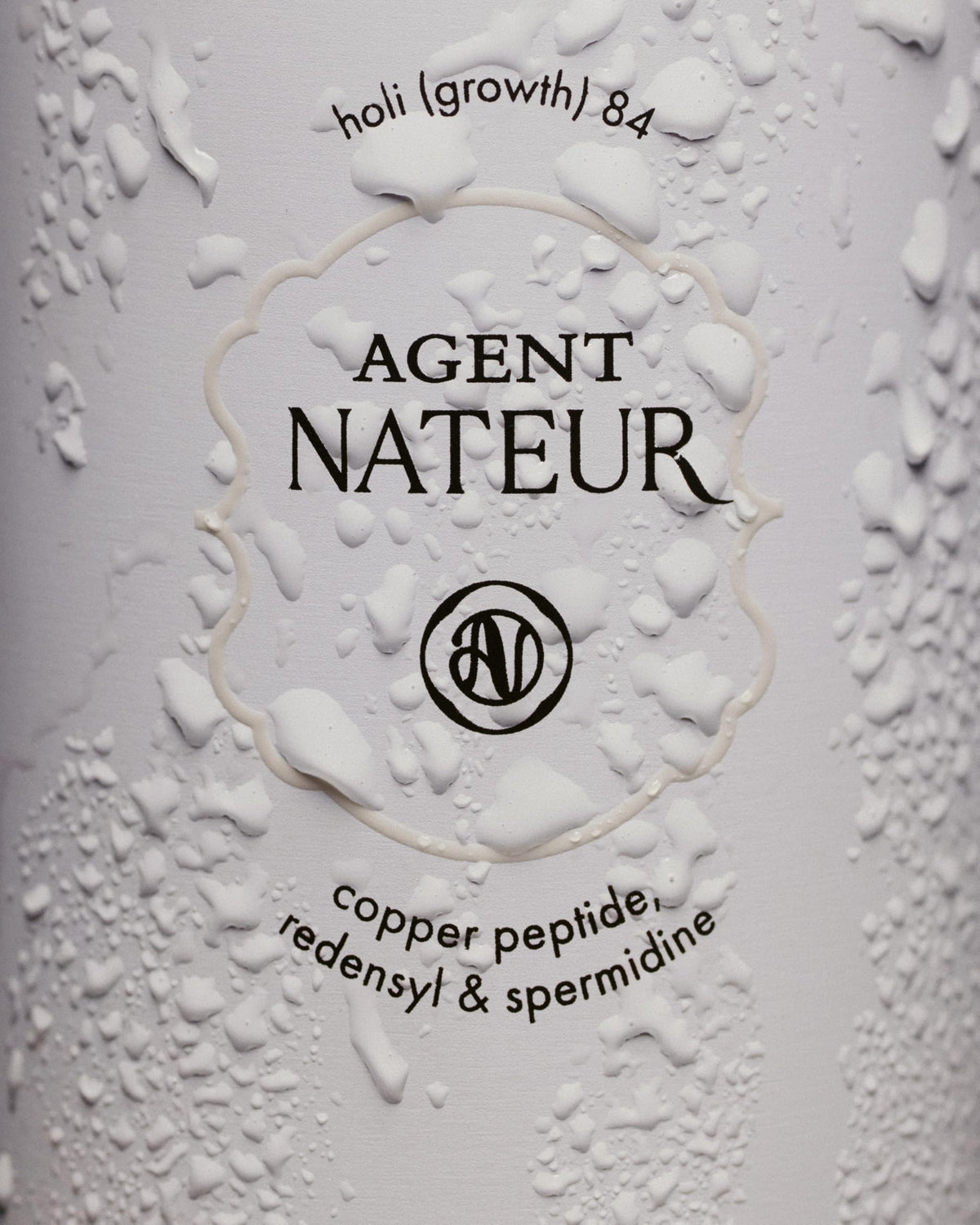 Agent Nateur holi (growth) 84 on bathroom shelf in lifestyle setting showing daily routine