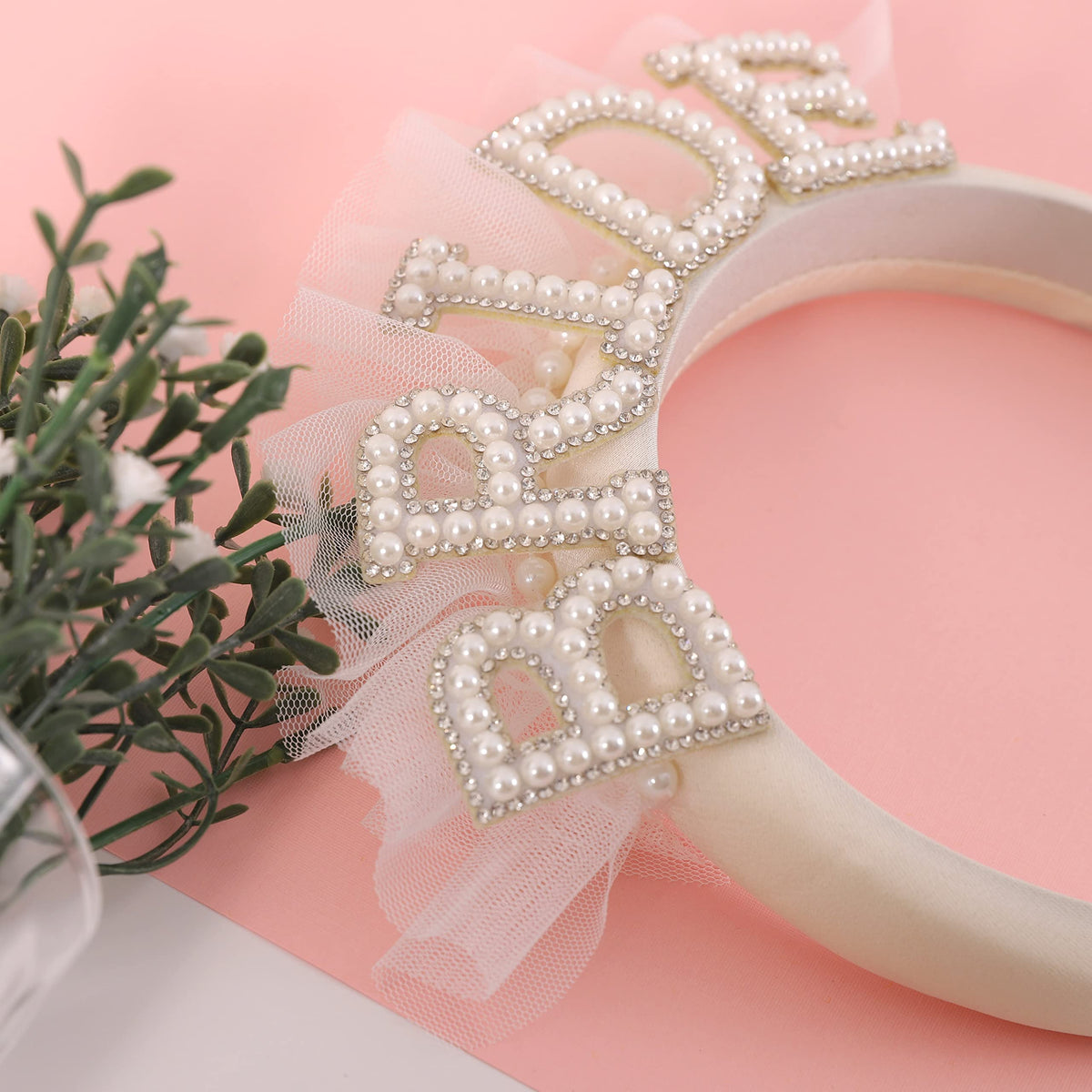 Agkvw closeup of pearl and rhinestone detail shows delicate sparkle