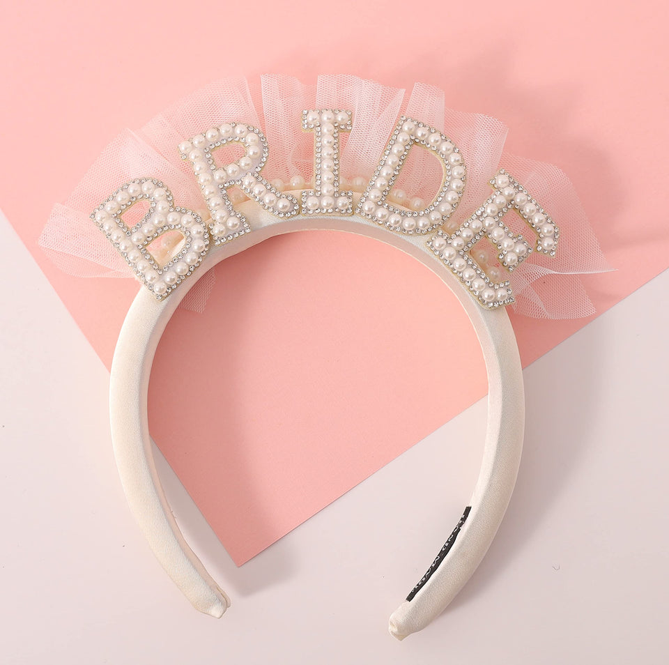 Agkvw front view white satin headband highlights bridal style