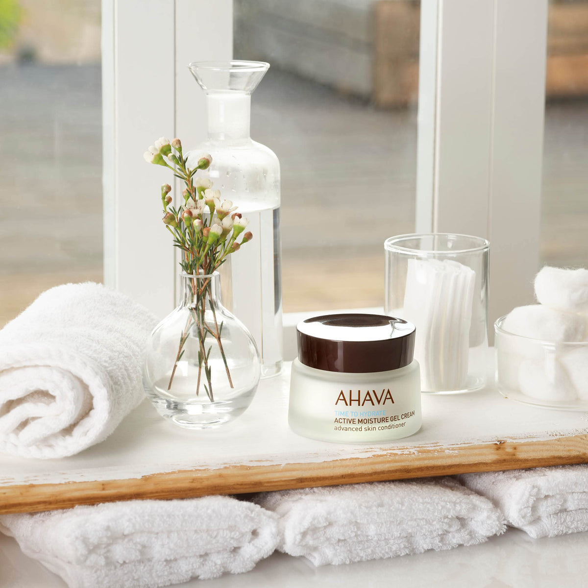 AHAVA application on skin demonstrating quick absorption and dewy finish