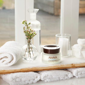AHAVA application on skin demonstrating quick absorption and dewy finish