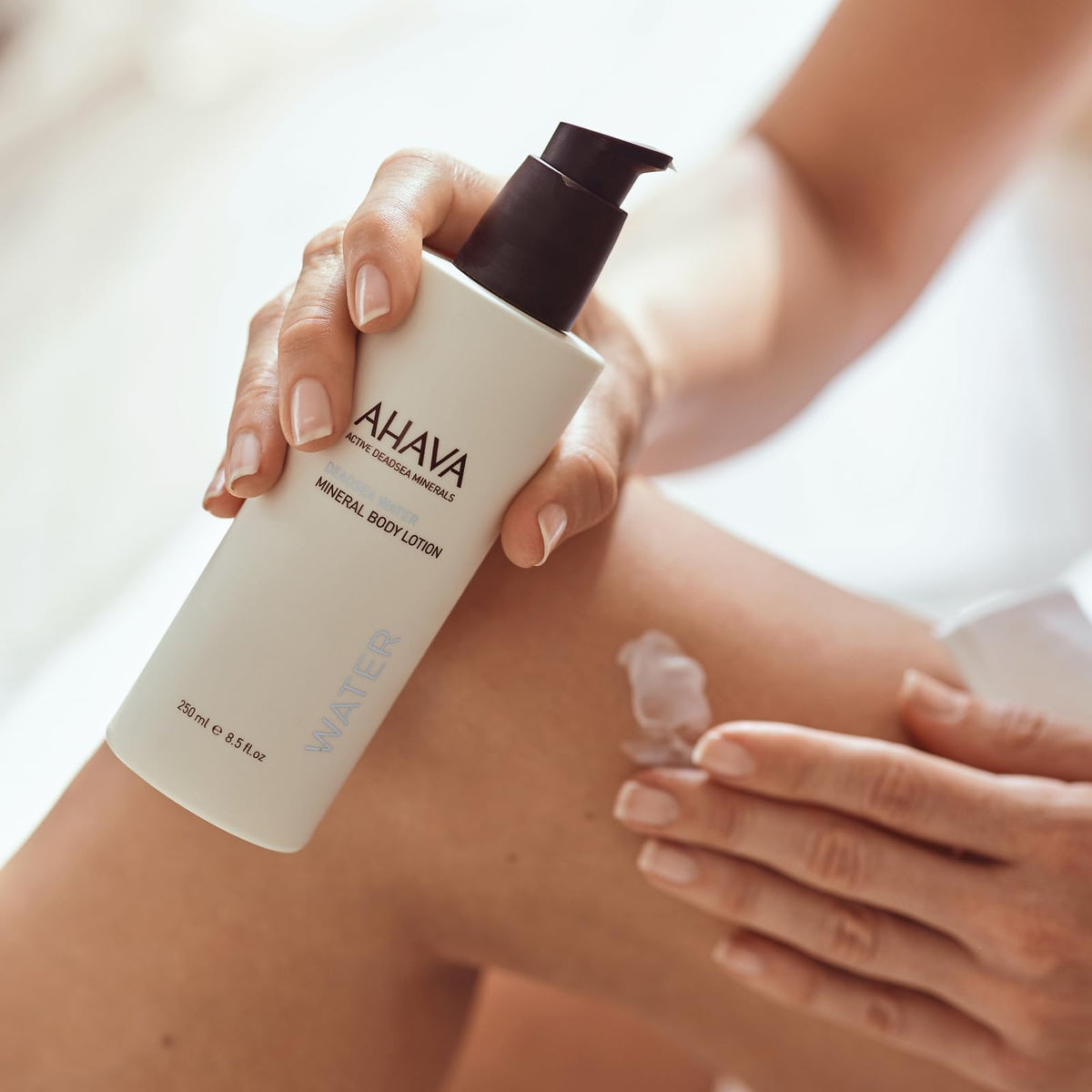 AHAVA next to ruler for size comparison of the 8.5 fl oz bottle