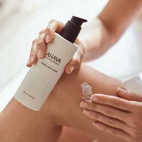 AHAVA next to ruler for size comparison of the 8.5 fl oz bottle