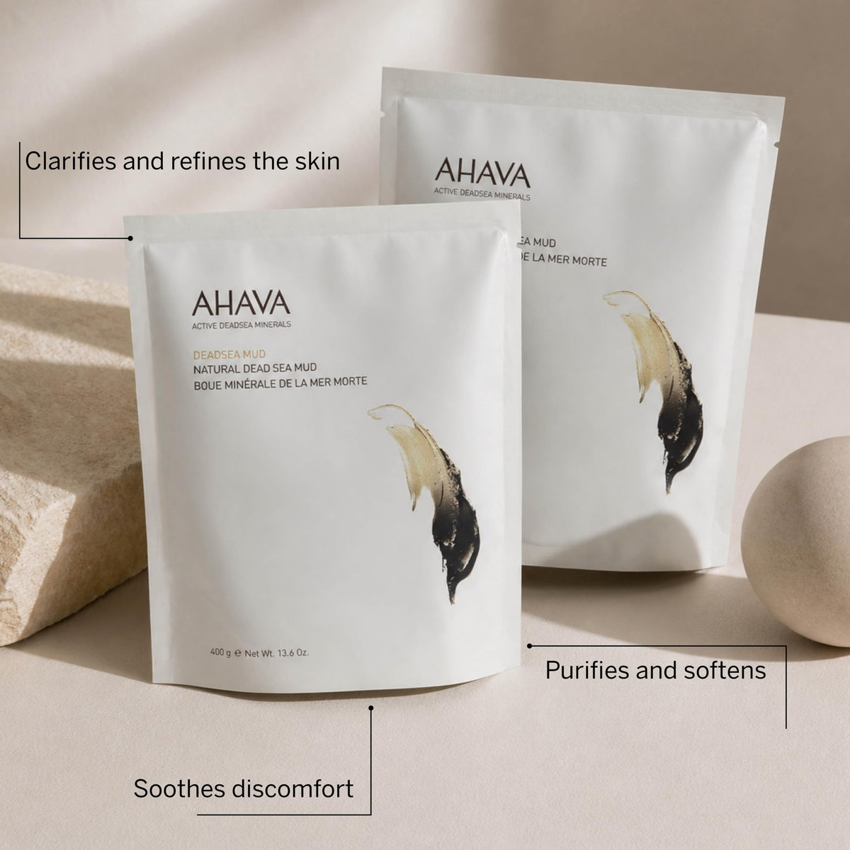 AHAVA applying mud to forearm to show application and comforting coverage after activity