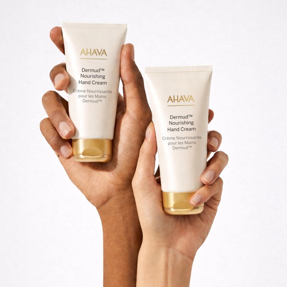 AHAVA hand cream being applied to hands providing immediate softness