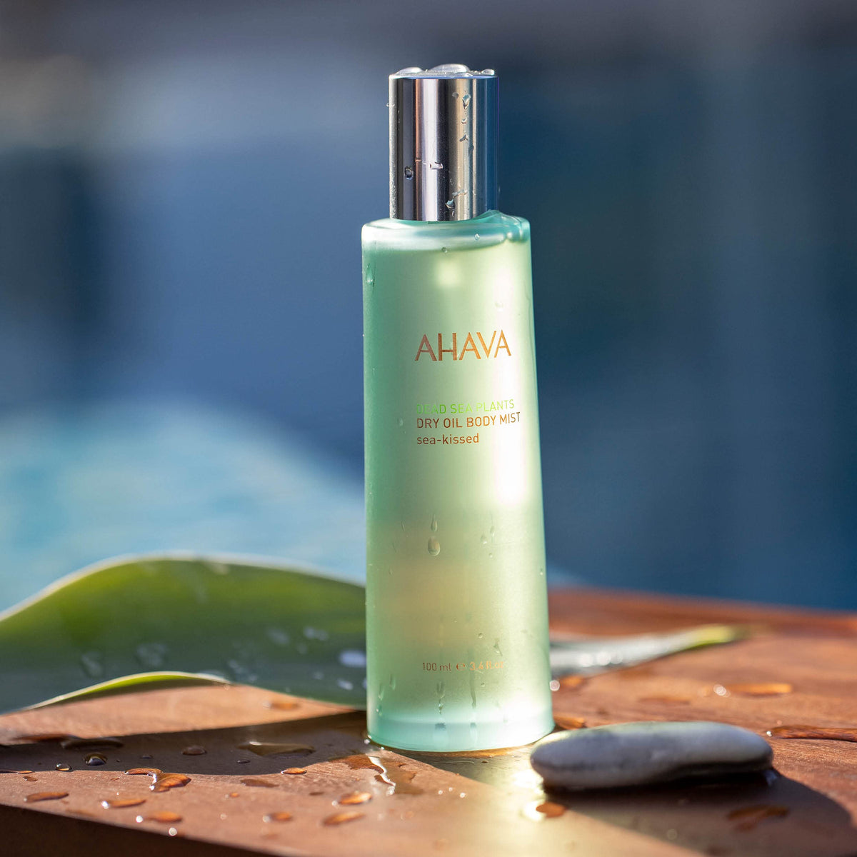 AHAVA close-up of mist nozzle and oil texture demonstrating fine spray benefit