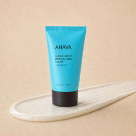 AHAVA cream applied on hands demonstrating softening effect and fast absorption