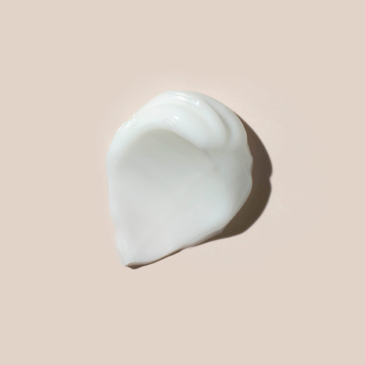 AHAVA moisturizer in hand to show 1.7 fl oz size and portability