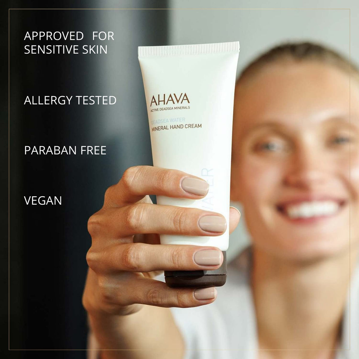 AHAVA 3.4 fl oz tube beside smartphone to show compact travel size