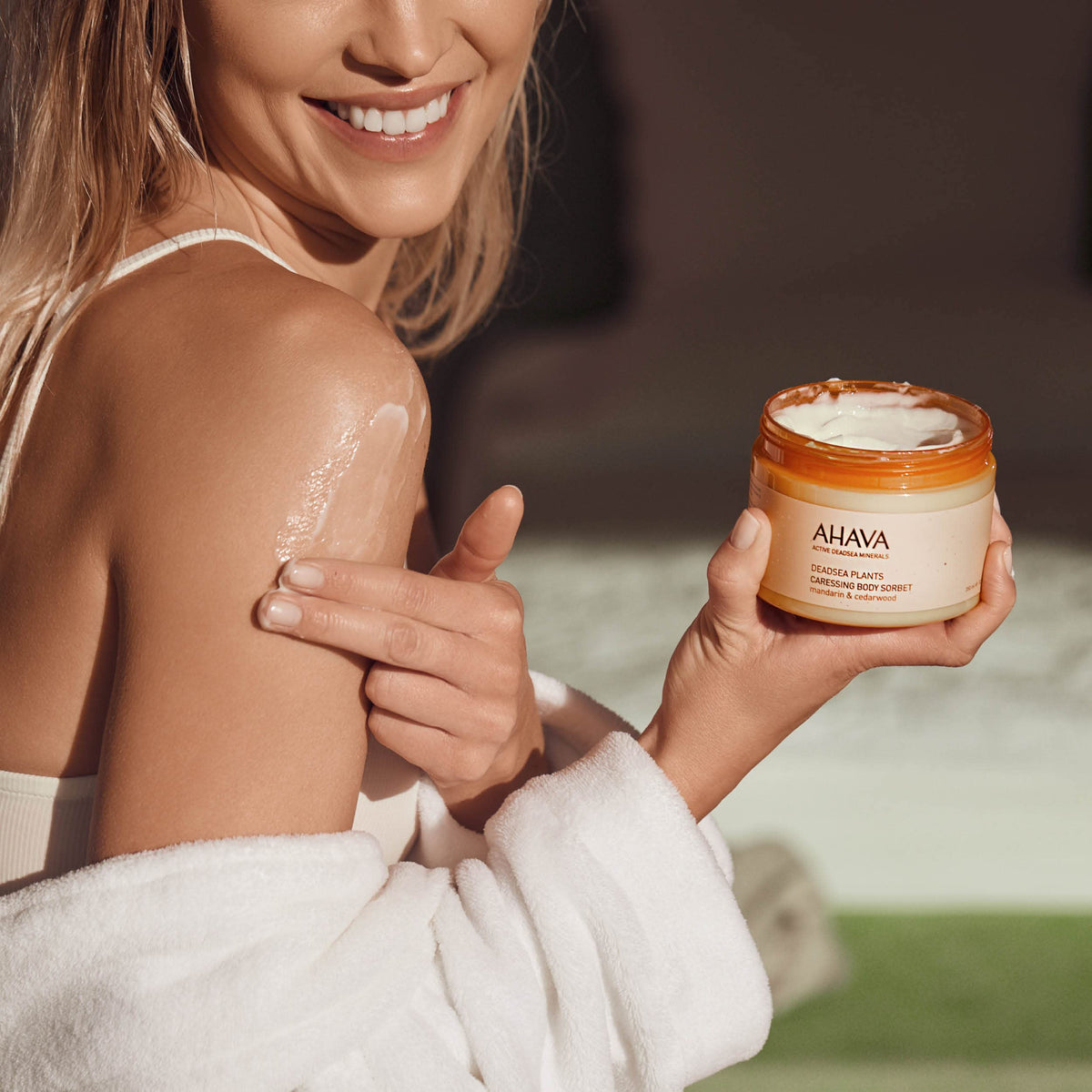 AHAVA bottle next to common objects showing 11.8 fl oz scale for accurate size perception