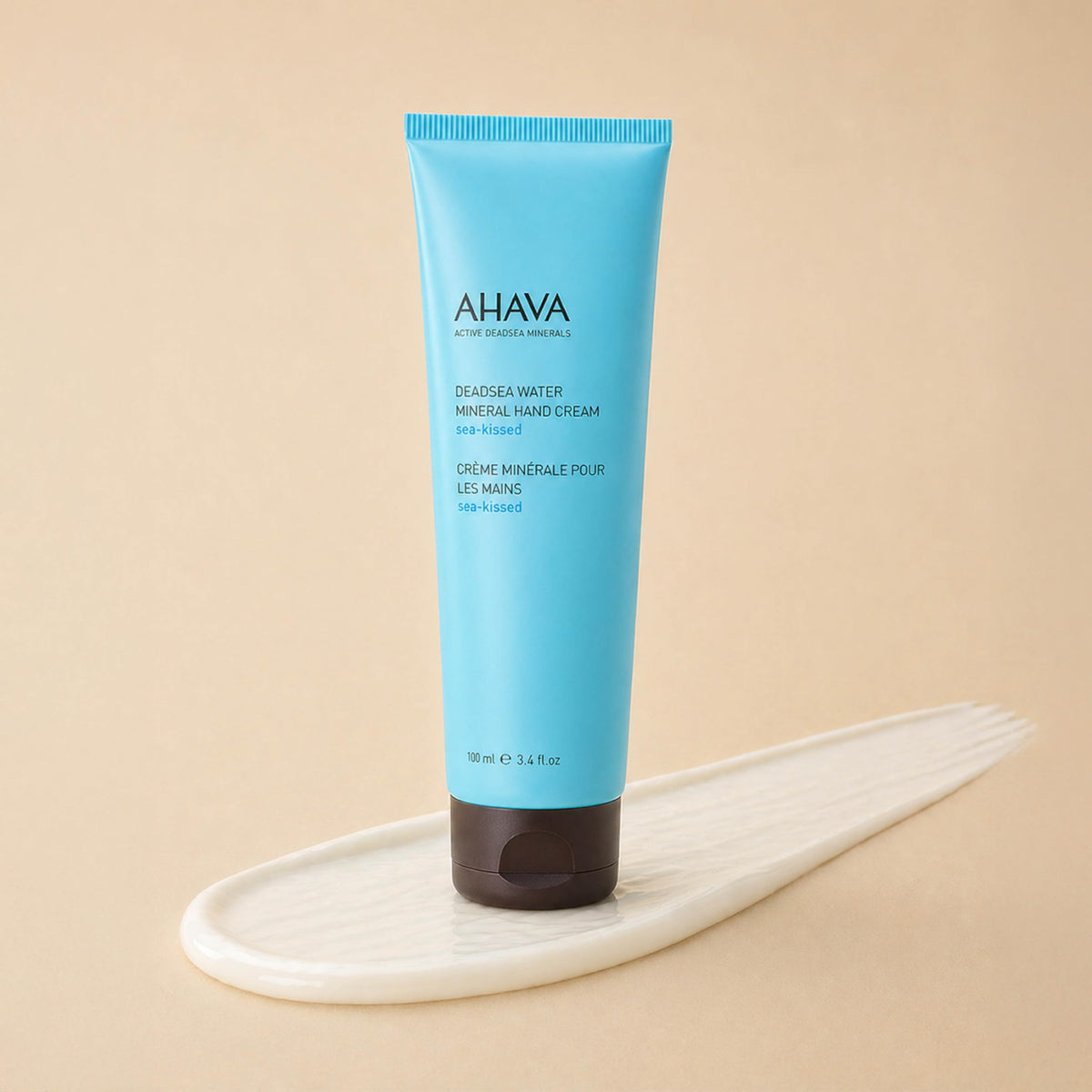 AHAVA tube next to everyday items showing 5.1 fl oz scale and travel-ready benefit