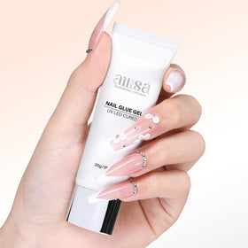 AILLSA holding rhinestone art to nail showing strong decorative adhesion