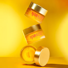 The Ayurveda Experience jar on nightstand to suggest calming bedtime routine benefit