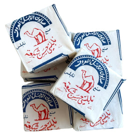 Al-Jamal soap lathered in hand demonstrating gentle cleansing