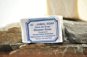 Al-Jamal soap producing soft lather in hand demonstrating gentle cleansing