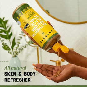 Alaffia pump dispensing creamy foam texture for gentle cleansing and easy use