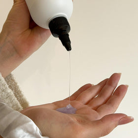 Alcôve products styled on bathroom shelf for everyday routine
