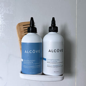 Alcôve duo styled in bathroom setting suggesting smooth, frizz-free hair