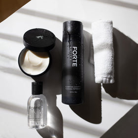 Alex Costa bottle on shower shelf in lifestyle scene showing daily use benefit