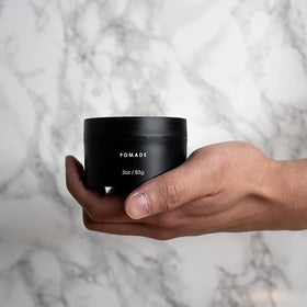 Alex Costa pomade on bathroom shelf in grooming routine conveying simple washout benefit
