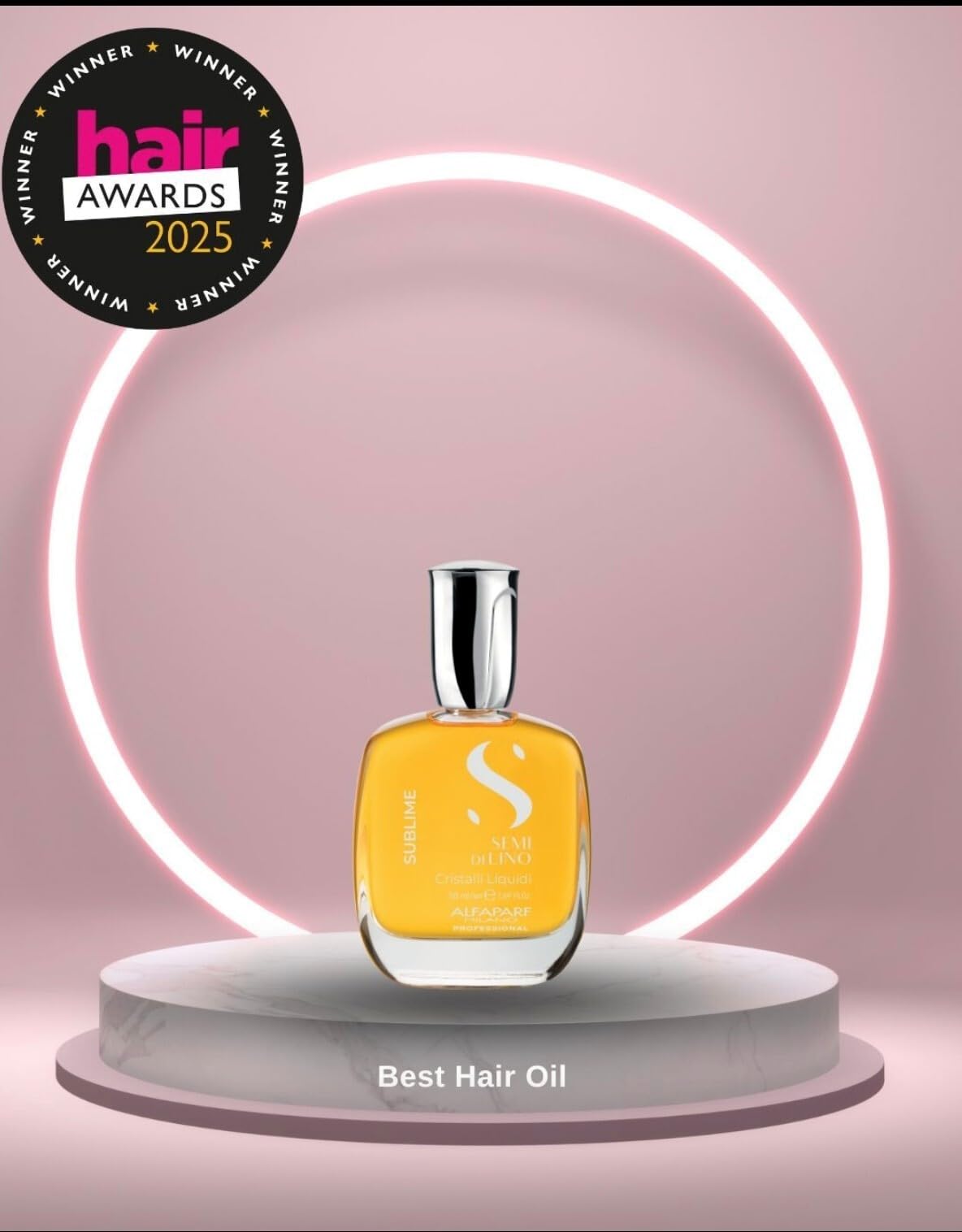 ALFAPARF MILANO bottle held in hand to show compact travel-friendly size advantage
