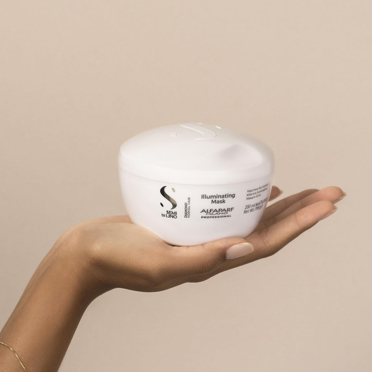 Alfaparf Milano mask applied to hair mid-lengths for deep conditioning