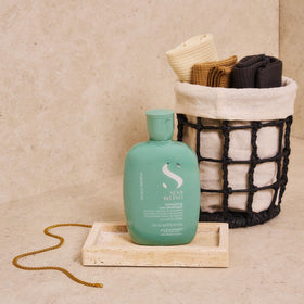 ALFAPARF MILANO shampoo in hand demonstrating lightweight lather and ease of use