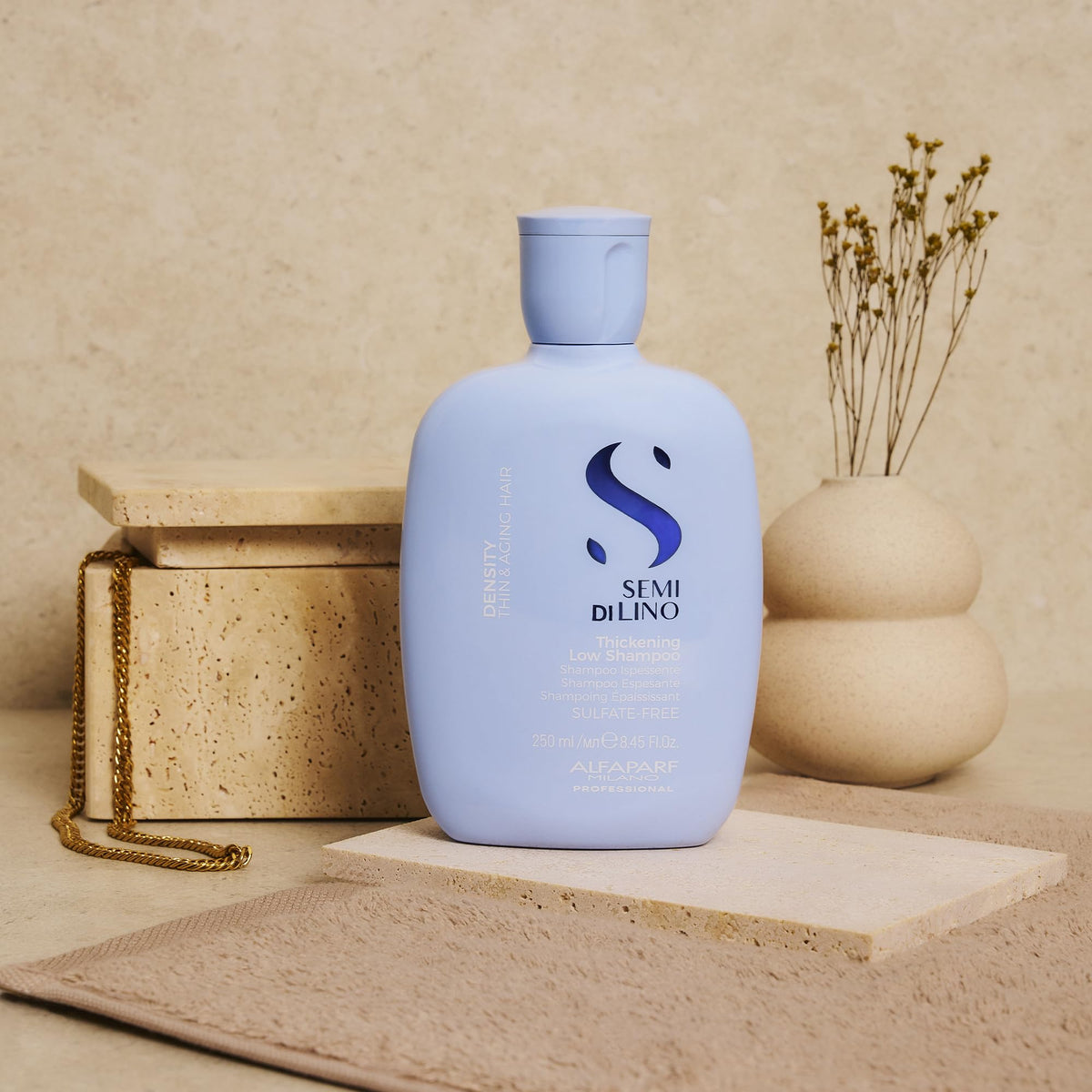 ALFAPARF MILANO shampoo in hand while applying to wet hair for root lift benefit