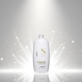 Alfaparf Milano conditioner texture pouring from bottle to show creamy lightweight formula for easy detangling