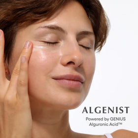 Algenist eye balm on fingertip ready to apply for quick depuffing and priming