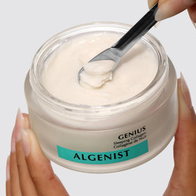 Algenist open jar top view showing creamy consistency and easy fingertip access
