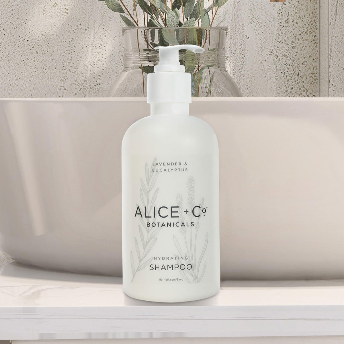 Alice + Co. bottle on hotel sink showing premium guest-experience benefit