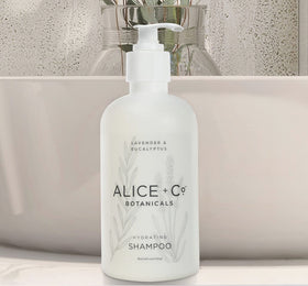 Alice + Co. bottles on hotel vanity conveying ready-to-use guestroom convenience