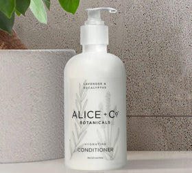 Alice + Co. bottles beside travel bag for packing ease and portable benefit