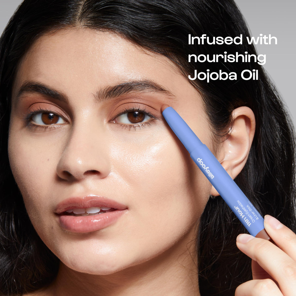 ALLEYOOP model applying stick to eyelid demonstrating quick, smudge-proof application
