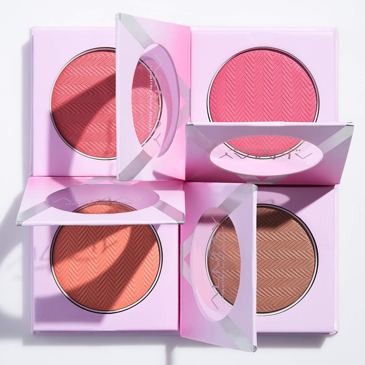 Almay blush in a makeup bag lifestyle scene showing everyday wearable color
