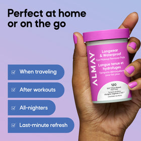 Almay pad beside a hand for scale to show compact, travel‑friendly size