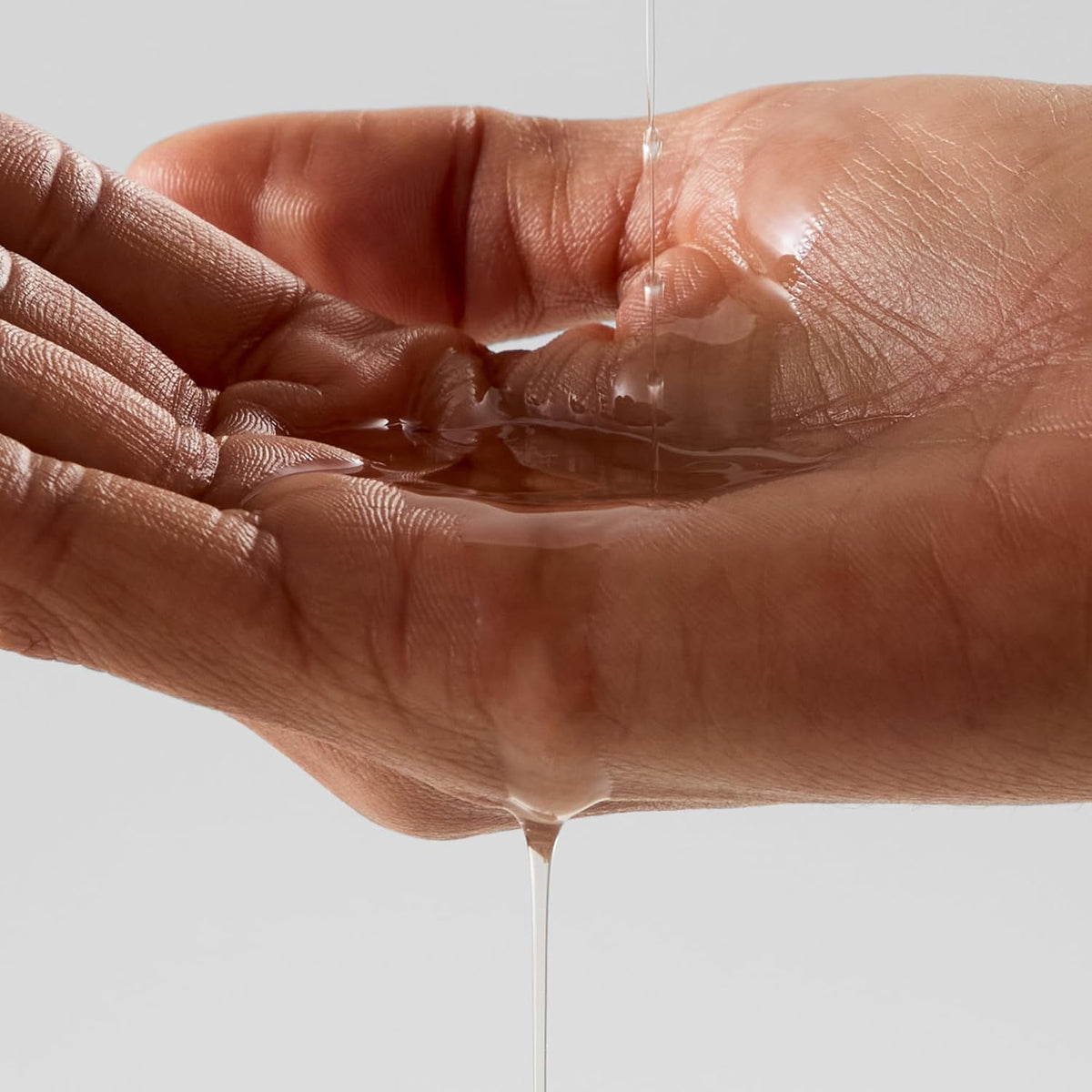 Alo applied on arm showing hydrated luminous skin and quick absorption