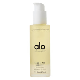 Alo bottle front view showing citrus-scented glow oil and packaging benefit