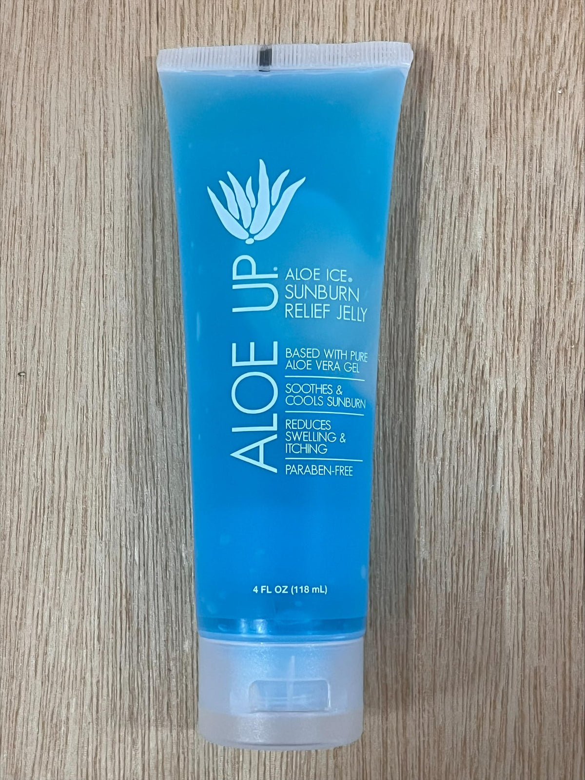 ALOE UP being applied to forearm to soothe sun-exposed skin