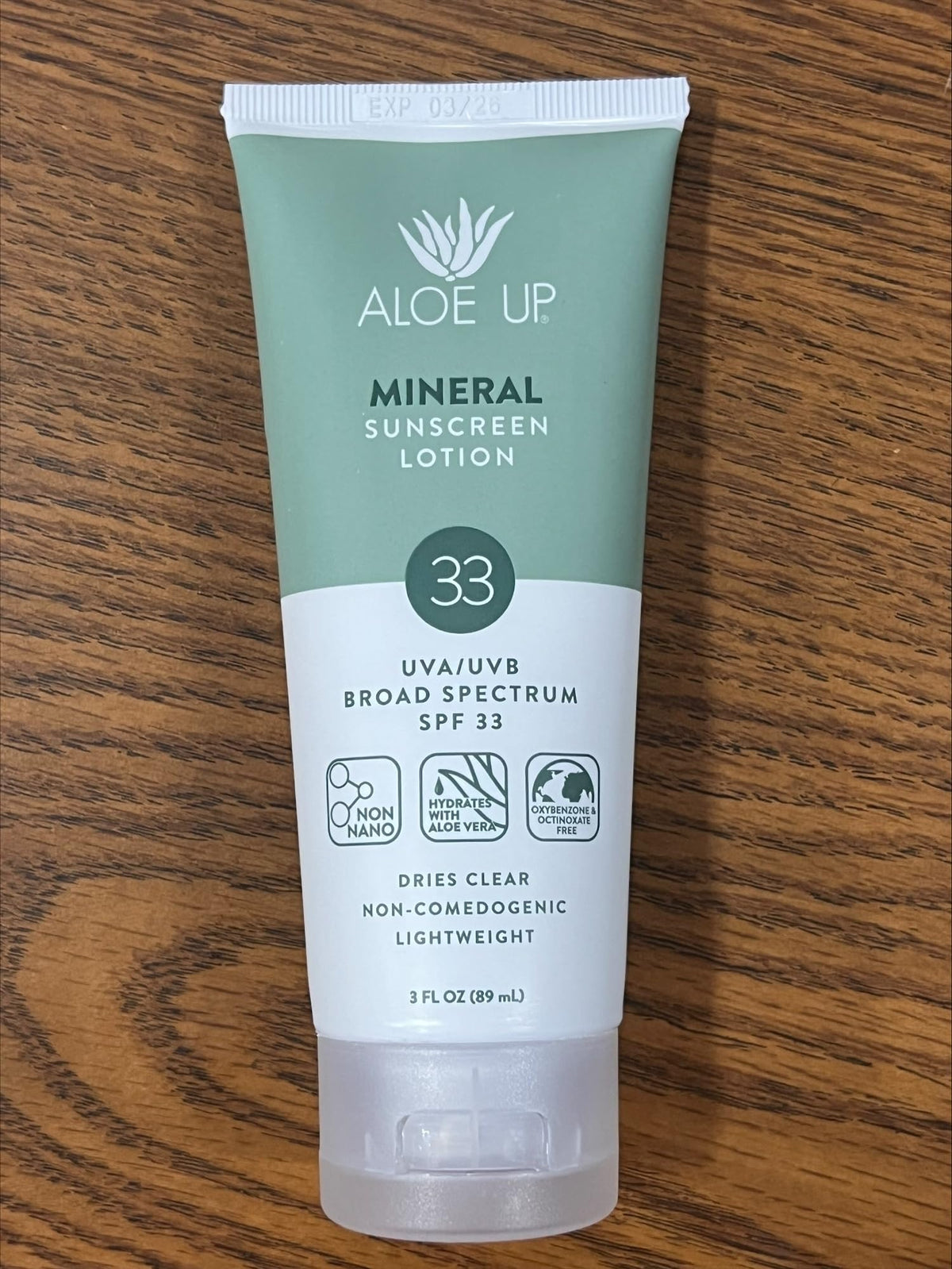 Aloe Up sunscreen in a beach setting illustrating water resistance and outdoor protection