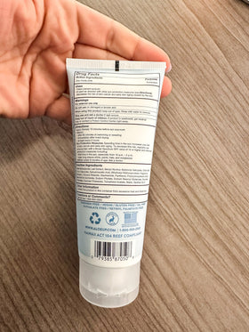 Aloe Up 3 oz tube beside a coin for scale, travel-friendly convenience