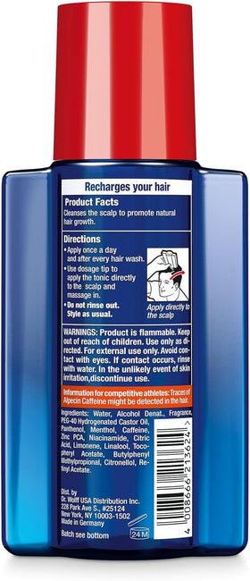 Man styling hair after Alpecin use showing fuller-looking hair and confidence