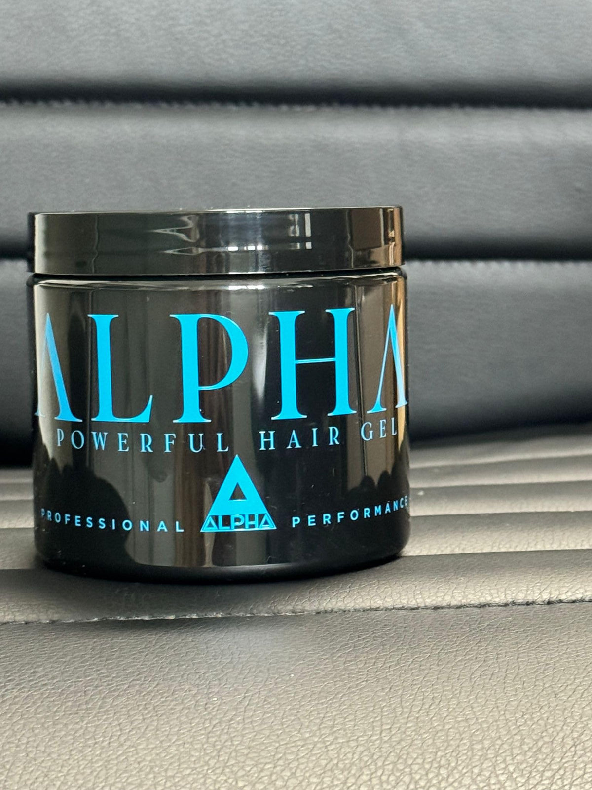 ALPHA gel next to a measuring cup showing 16oz size for long-lasting supply benefit